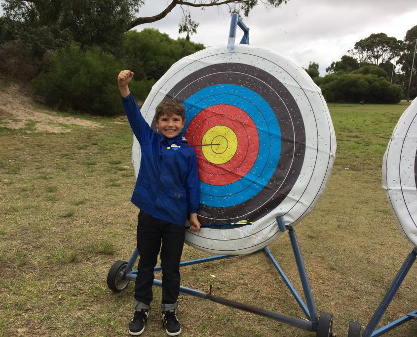 excited student at archery target