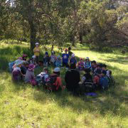 Students sitting in a circle in the bush