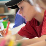 Boy writing on paper