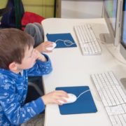 students learning how to use computers