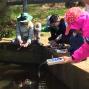 Kids testing water pollutants