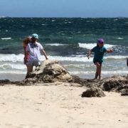 Kids running on the beach