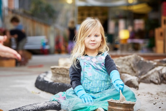 student in the sandpit