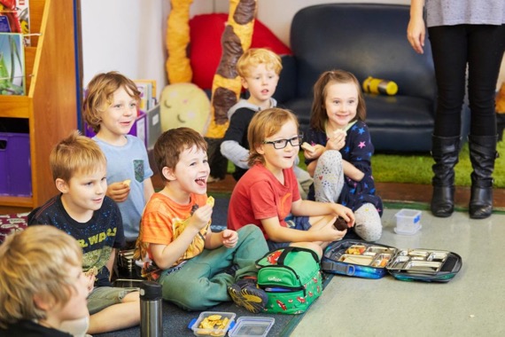 students eating morning tea on the mat