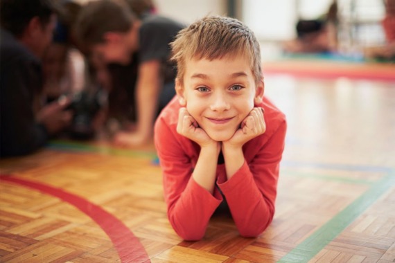 boy smiling at basketball